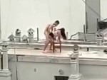 Couple Going For It On Their Apartment Building
