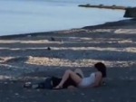 Head Between Her Legs On The Beach

