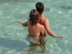 Not So Subtly Wanks Off Her Man In The Ocean
