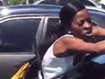 Angry Woman Trashes A Car Who Knows Or Cares Why
