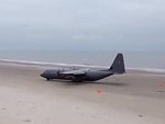 Army Plane Takes Off From A Beach
