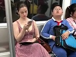 Boy Is Quite Taken With A Lady Subway Rider
