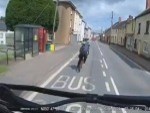 Cyclist Makes Room For The Car To Pass
