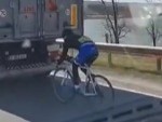 Cyclist With Massive Nuts Drafting A Truck
