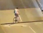 Foolish Cyclist Tries To Ride Over A Draw Bridge
