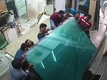 Glass Sheets Fall And Trap Workers Against A Bench Ouch

