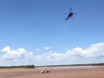 Helicopter Rescues A Boat Trapped By The Tide
