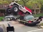Monster Truck Takes On A Couple Of Cop Cars
