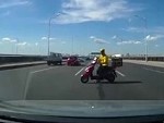 Scooterer Idiotically Goes The Wrong Way Across A Freeway
