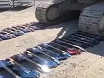 Shitload Of Gibson Guitars Destroyed With An Excavator
