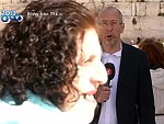 Toothless Woman Interrupts A Journalist
